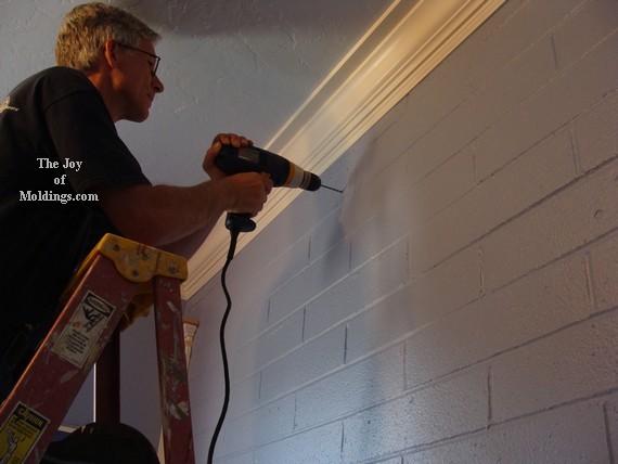 1_how-to-install-diy-picture-rail-molding-108 install moldings on brick wall